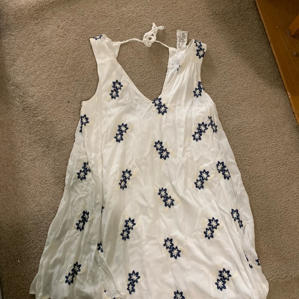 White tank dress with blue embroidered flowers